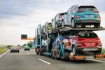 Cars carrier truck at asphalt highway road in Poland